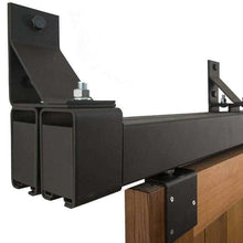 Load image into Gallery viewer, Black Box Rail 600lb Bypass Hardware installed on brown barn door