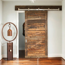 Load image into Gallery viewer, Box Rail Barn Door hardware installed on reclaimed wood door in a living space
