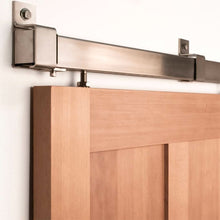 Load image into Gallery viewer, Box Rail Barn Door hardware installed on a beech wood door.
